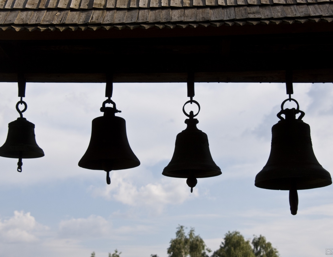 Church bell rushes over the world singing  a lofty song...