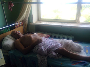Yuri was caught in a heavy barrage of mortar fire and now lies in a provincial hospital in the Russian town of Donetsk. Photo by Courtney Weaver